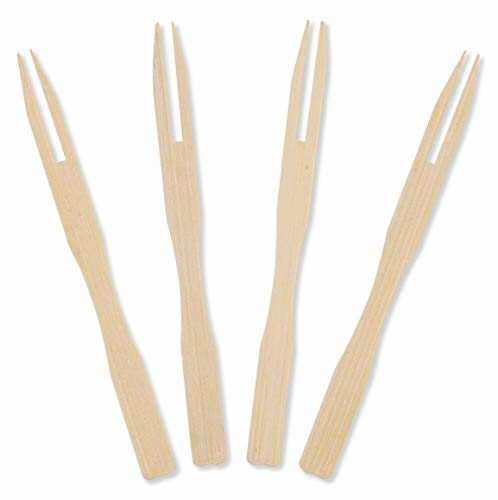 Four bamboo fruit forks on a white background.